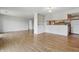 Bright and spacious living room featuring hardwood floors and an open concept to the kitchen at 5038 Allisonville Rd # E, Indianapolis, IN 46205
