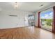 Bright and spacious living room with hardwood floors and a large window with a view of the water at 5038 Allisonville Rd # E, Indianapolis, IN 46205