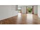 This spacious living room boasts wood floors, built-in shelving, and abundant natural light at 5038 Allisonville Rd # E, Indianapolis, IN 46205