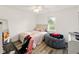Bright bedroom with a large window, wood-look flooring and a comfortable beanbag chair at 5200 N Leslie Dr, Muncie, IN 47304