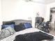 Modern bedroom featuring a plush bed, a dedicated desk area, and stylish decor, designed for comfort and functionality at 5200 N Leslie Dr, Muncie, IN 47304