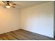 Bright, empty room with ceiling fan and modern flooring. Ready to be furnished and personalized as a bedroom at 5200 N Leslie Dr, Muncie, IN 47304