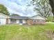Well-kept single-story home with a green lawn, brick accents, and a inviting front entrance on a sunny day at 5200 N Leslie Dr, Muncie, IN 47304