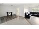 Open-concept living room with laminate flooring, neutral paint, and ample natural light at 5200 N Leslie Dr, Muncie, IN 47304