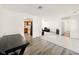 Bright living room featuring a view into kitchen and open floor plan at 5200 N Leslie Dr, Muncie, IN 47304
