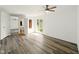 Main bedroom features light gray flooring, a ceiling fan, and ensuite bathroom at 5200 N Leslie Dr, Muncie, IN 47304