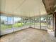 Sunroom filled with natural light from its many windows, offering views of the backyard at 5200 N Leslie Dr, Muncie, IN 47304