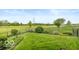 Expansive backyard with lush greenery and mature trees, perfect for outdoor enjoyment at 5410 Brassie Dr, Indianapolis, IN 46235
