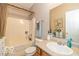 Bathroom showcasing a clean vanity, functional shower/tub combo, and neutral color palette at 5410 Brassie Dr, Indianapolis, IN 46235