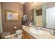 Bathroom featuring a functional sink, mirror, and a well-lit shower/tub area at 5410 Brassie Dr, Indianapolis, IN 46235