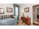 Bedroom with desk, natural light, offering comfort and study space at 5410 Brassie Dr, Indianapolis, IN 46235