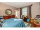Bedroom featuring natural light, wooden furniture, and pleasing decor at 5410 Brassie Dr, Indianapolis, IN 46235