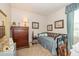Cozy bedroom with comfortable bed, wooden furniture and serene ambiance at 5410 Brassie Dr, Indianapolis, IN 46235