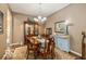 Formal dining room with hardwood floors and an elegant chandelier at 5410 Brassie Dr, Indianapolis, IN 46235