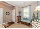 Welcoming foyer with natural light, a storage bench, and a view into the home's interior at 5410 Brassie Dr, Indianapolis, IN 46235