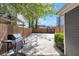 Backyard featuring a concrete patio, wooden fence, barbecue grill, and potential for outdoor activities at 543 Fletcher Ave, Indianapolis, IN 46203