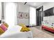 Comfortable bedroom with a full bed, two windows and ample natural light at 543 Fletcher Ave, Indianapolis, IN 46203