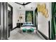 Bedroom with a four poster bed, gold wall decor, ceiling fan and neutral carpet at 543 Fletcher Ave, Indianapolis, IN 46203