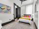Inviting bedroom with plush bedding and large window offering natural light at 543 Fletcher Ave, Indianapolis, IN 46203