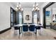 Elegant dining room showcases modern lighting, stylish blue chairs, and contemporary decor at 543 Fletcher Ave, Indianapolis, IN 46203
