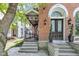 Inviting front entrance with stone steps leading to a double door with arched window above at 543 Fletcher Ave, Indianapolis, IN 46203