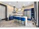 Beautiful kitchen features exposed brick, stainless steel appliances, and a stylish island with seating at 543 Fletcher Ave, Indianapolis, IN 46203