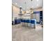 Stunning kitchen boasts stainless steel appliances, a large island, and exposed brick accents at 543 Fletcher Ave, Indianapolis, IN 46203
