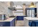 Bright kitchen features stainless steel appliances, custom cabinets, and exposed brick accents at 543 Fletcher Ave, Indianapolis, IN 46203