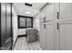 Well-lit laundry room featuring modern appliances and ample storage cabinets at 543 Fletcher Ave, Indianapolis, IN 46203