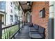 Inviting front porch with outdoor seating and classic railing, offering a cozy spot at 543 Fletcher Ave, Indianapolis, IN 46203