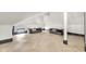 Bright recreation room with ample space, recessed lighting, wood floors, and windows at 543 Fletcher Ave, Indianapolis, IN 46203
