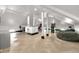Bright recreation room with ample space, recessed lighting and wood floors at 543 Fletcher Ave, Indianapolis, IN 46203
