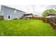 Backyard with patio, pergola and dining area, offers a great space for outdoor activities at 5522 Grassy Bank Dr, Indianapolis, IN 46237