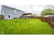 Backyard with patio, pergola and dining area, offers a great space for outdoor activities at 5522 Grassy Bank Dr, Indianapolis, IN 46237