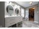 Bathroom featuring a double sink vanity, vanity lighting, and tile flooring at 5522 Grassy Bank Dr, Indianapolis, IN 46237