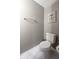 Clean, simple half bathroom with toilet and wall decor at 5522 Grassy Bank Dr, Indianapolis, IN 46237