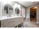 Bathroom featuring a double sink vanity, vanity lighting, and tile flooring at 5522 Grassy Bank Dr, Indianapolis, IN 46237