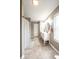 Bathroom with a double vanity, decorative mirrors, a window, and tiled floors at 5522 Grassy Bank Dr, Indianapolis, IN 46237