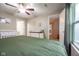 Bright bedroom featuring a ceiling fan, neutral walls, a white crib and white dresser at 5522 Grassy Bank Dr, Indianapolis, IN 46237