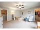 Bright bedroom with an open closet and comfortable chair at 5522 Grassy Bank Dr, Indianapolis, IN 46237