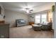 Cozy bedroom with crib and chair and ottoman, filled with natural light from the large windows at 5522 Grassy Bank Dr, Indianapolis, IN 46237