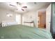 Bright bedroom featuring a ceiling fan, neutral walls, a white crib and white dresser at 5522 Grassy Bank Dr, Indianapolis, IN 46237