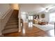 Inviting foyer showcasing hardwood floors and a staircase leading to the upper level at 5522 Grassy Bank Dr, Indianapolis, IN 46237