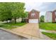 Two-story home with brick and siding, features a two car garage and manicured lawn at 5522 Grassy Bank Dr, Indianapolis, IN 46237