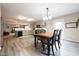 Bright kitchen featuring gray cabinets, stainless steel appliances, and an adjoining dining area at 5522 Grassy Bank Dr, Indianapolis, IN 46237