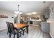 Bright kitchen featuring gray cabinets, stainless steel appliances, and an adjoining dining area at 5522 Grassy Bank Dr, Indianapolis, IN 46237
