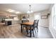 Bright kitchen featuring gray cabinets, stainless steel appliances, and an adjoining dining area at 5522 Grassy Bank Dr, Indianapolis, IN 46237