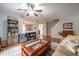 Inviting living room featuring hardwood floors, open layout, and stylish decor at 5522 Grassy Bank Dr, Indianapolis, IN 46237
