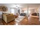 Cozy living room with hardwood floors, large windows, and comfortable seating at 5522 Grassy Bank Dr, Indianapolis, IN 46237