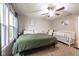 Comfortable main bedroom with ceiling fan and large windows providing ample light at 5522 Grassy Bank Dr, Indianapolis, IN 46237